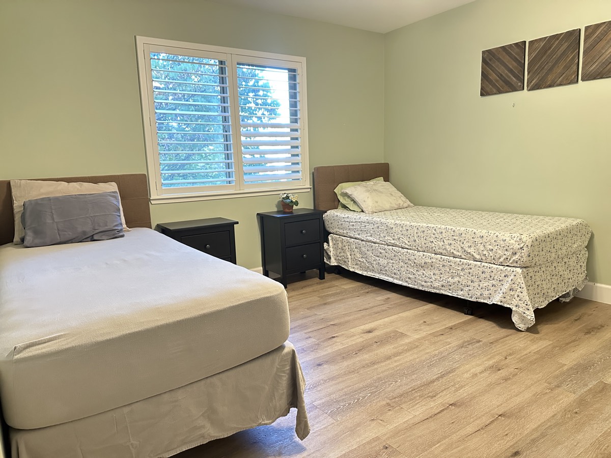 The shared room at The Gardens, with two beds